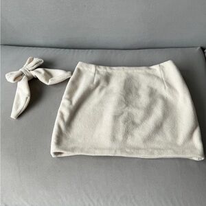 Cute mini skirt and it’s hair bow